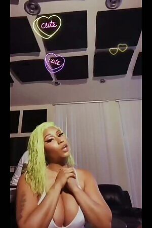 Nicki Minaj juggling her big tits until her areola peaks out on ig