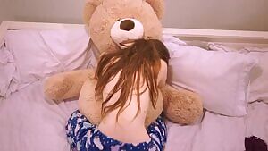 Shy girl grinds on teddy