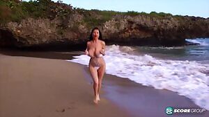 Sha Rizel running on the beach