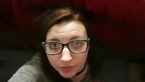 Nerdy girlfriend taking facial cumshot