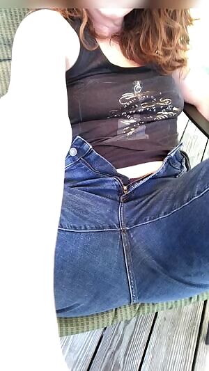 Outside on the deck, fully clothed.