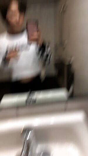 Wearing a see through crop top with no bra, flashing in the public bathroom