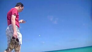 Walking around with a shirt skirt and topless at the beach