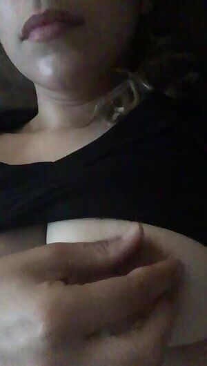 Playing with her nipples