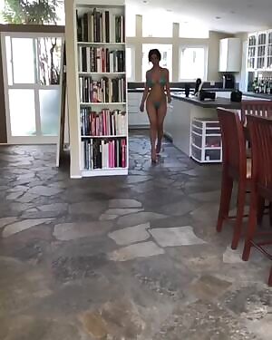 Walking through the kitchen in a bikini and heels, as you do