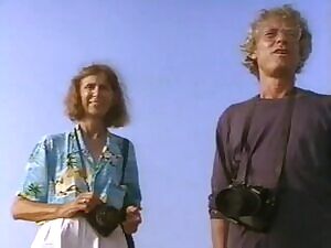 Stephanie Seymour getting dusted off for a Sports Illustrated swimsuit shoot in the 80s