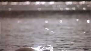 Julie Warner rising from the water in 