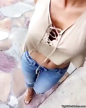 shows her hard bolted on tits and flat belly GIF