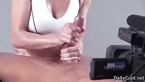 Milking his cock with her hands