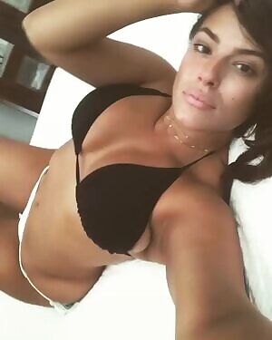 Ashley Graham in a showing off in a bikini. Grab your cock and pump out a load for her.