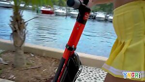 Scootin' and flashing her ass and titties out in public