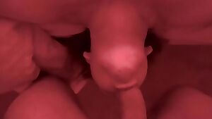 Fucking her face and cumming on her tits under red lights.