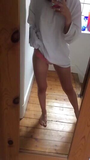 In the mirror showing her body