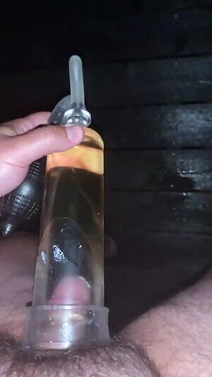 pissing into an cock pump
