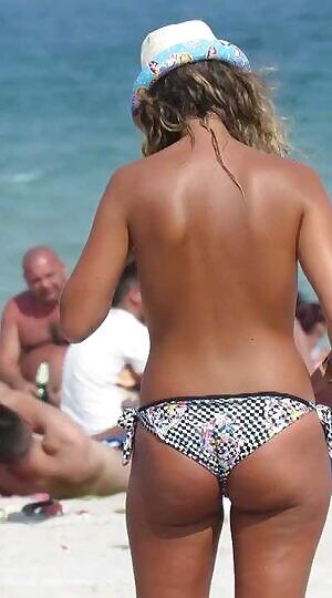 Topless On The Beach