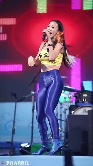 Korean dancer in tight yellow top & blue pants