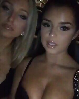 Playing with her friend's boobs