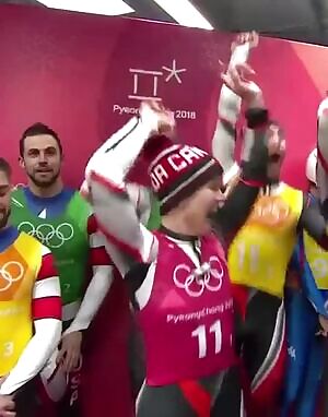 Alex Gough celebrating winning silver in luge team relay.