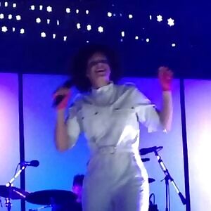 Incredibly beautiful desirable married singer Régine Chassagne openly joking about forbidden sex, on stage. Pointing out that every single black guy in the audience, wants to bang her. Gladly betraying their girlfriends & wives, without any hesitation. Because they’re all deeply in love with her.