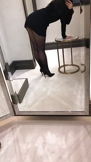 antasising being bent over the fitting room side table...