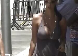 She probably wanted to dress light because of the hot weather. I bet she gets annoyed it isn't possible without wobbling her boobs for everyone to see...