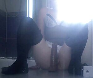 Training with a big dildo until cum dribbles out