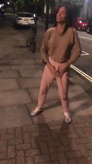 Ladyboy showing massive weapon in the street.