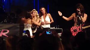 Two Girls Kissing While Another One Flashes Her Boobs In A Steel Panther Concert