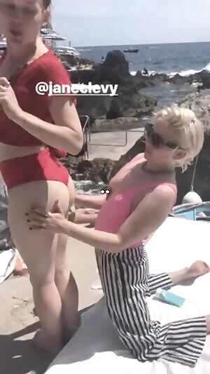 Jane Levy getting her butt rubbed by Mae Whitman