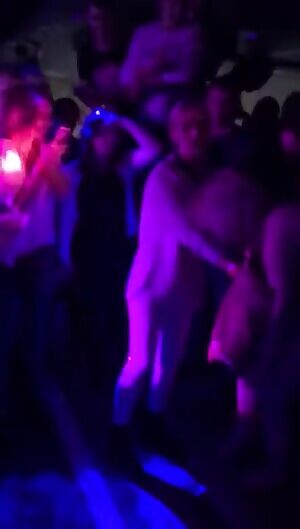 Undresses in public for money, covers up with a tiny towel. ENF