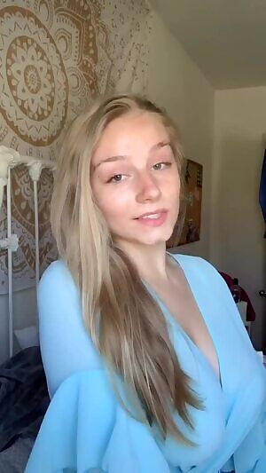 Hot blonde grabs her big tits