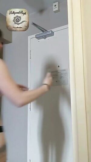 Two Delivery guys get to see Holly answer the door.