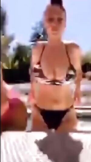 Big titty white girl twerking and bouncing her fat tits around in the pool