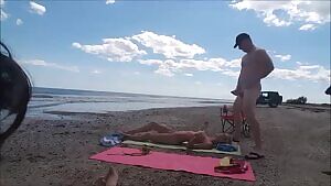 Husband Allows wife to take cum-shot at nude beach