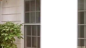 Debbe Dunning oiling herself in a bikini