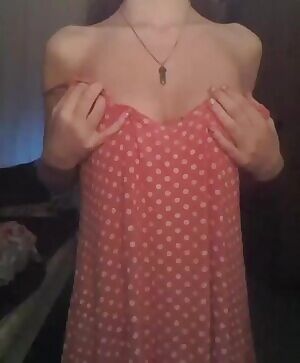 Dropping her delightful dress