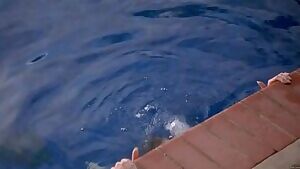 Jaime Pressly erupting from the pool