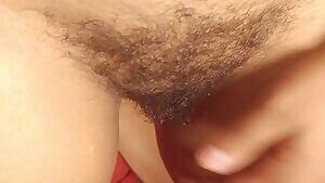 Playing in her bush!