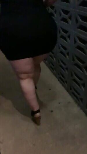 Mom walking in her dress & heels last night after I picked her up from the bar. She had a fun night with her friends.