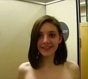 Shy teen stands on her tippy toes to give you a better look at what God gave her