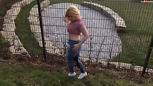 beautiful girl with wet pants gets peed on