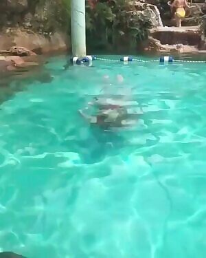 Amber Haynes coming out of the pool