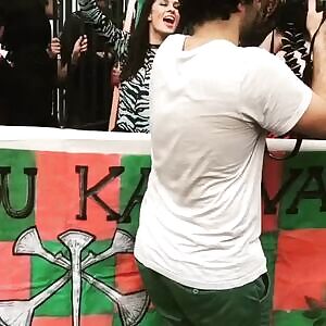 Lovely desirable beauty Régine Chassagne making her delightful perfect big tits wildly bounce around, during festivities in New Orleans. Easily seducing every single guy watching. Not wearing any bra. Underneath her light-green sensual tight outfit.