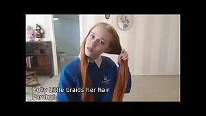 Dolly Little braids her hair